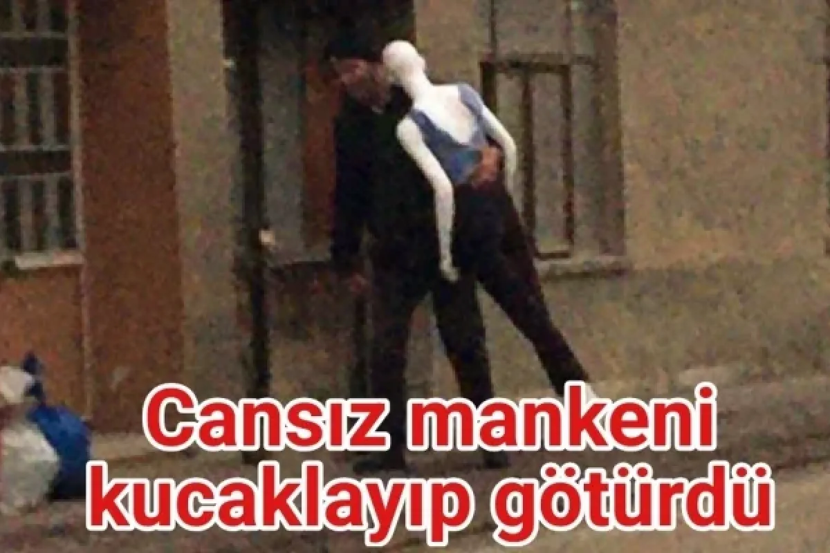 Cansız mankeni kucaklayıp götürdü