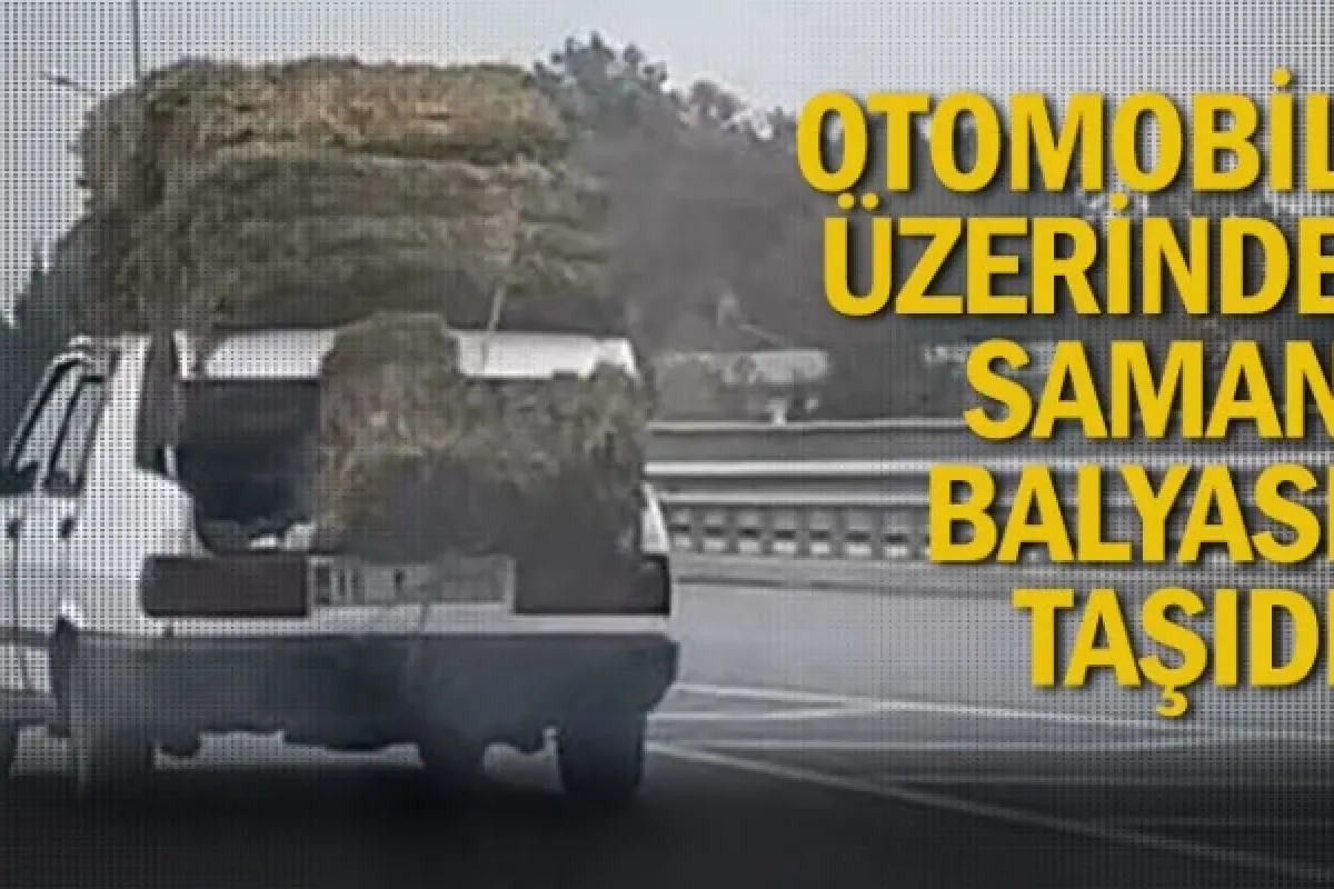Otomobil üzerinde saman balyası taşıdı