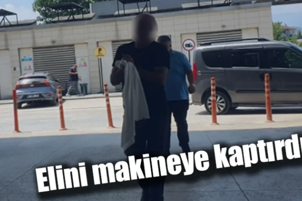 Elini makineye kaptırdı