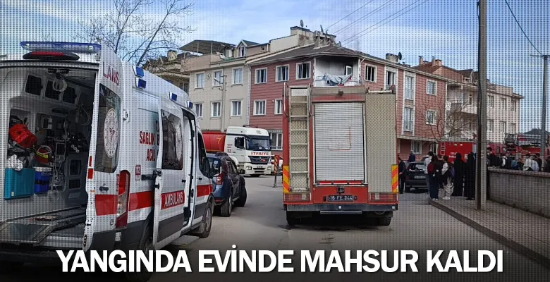 Yangında evinde mahsur kaldı