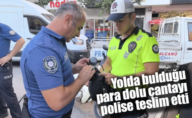 Yolda bulduğu para dolu çantayı polise teslim etti